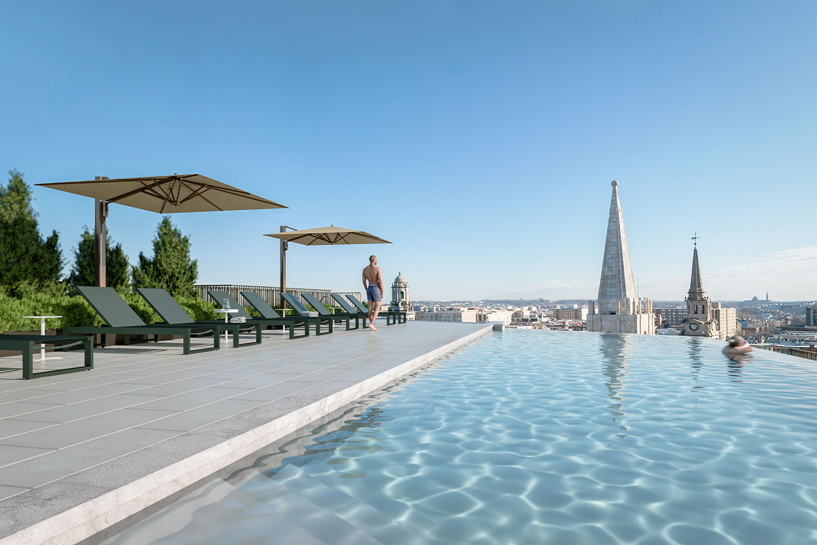 Rooftop infinity pool & deck with expansive city views