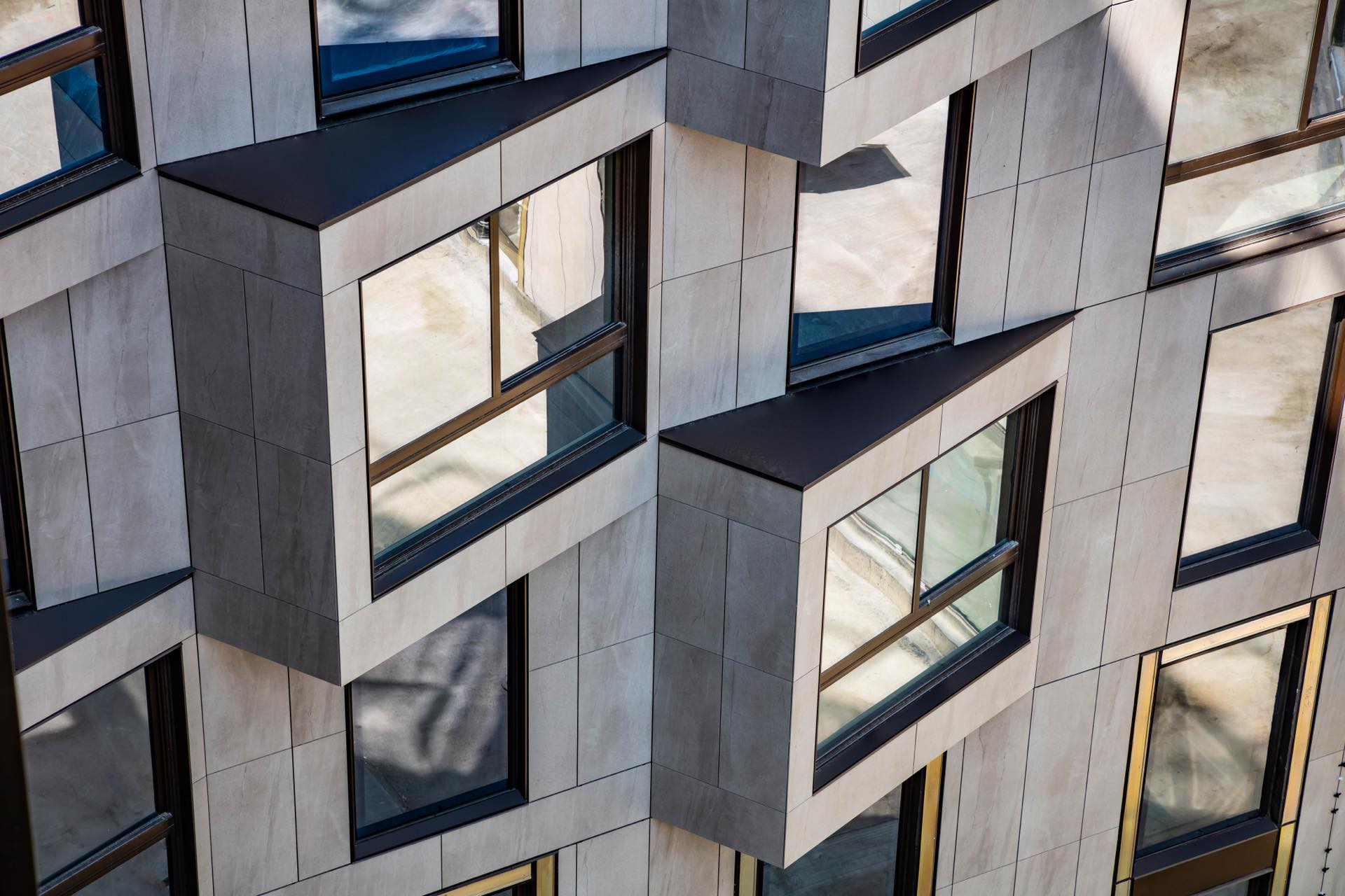 A unique, rhythmic window placement defines the Silva’s facade